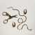 kolczyki-owalne-żmijka_nożyczki.png